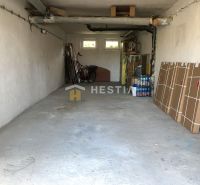 Garage in a 3-room apartment with storage space and a bicycle.