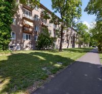 An apartment building surrounded by greenery on Obežná Street in Bratislava - Ružinov.