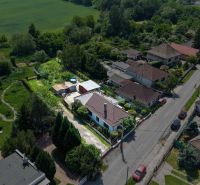 A family house in Topoľnica on Topoľnica Street with a garden and surrounding greenery.