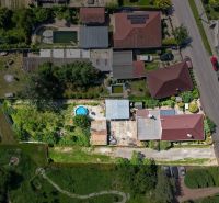 Aerial view of a family house in Topoľnica on Topoľnica Street with a garden and a swimming pool.