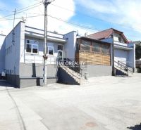 Exterior of the gastro premises on Okružná with access stairs and a glass-covered terrace.