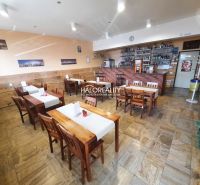Gastro premises with a bar and wooden furniture, floor with wooden decor.