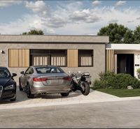 A family house on Slnečná Street in Miloslavov with parked cars and a motorcycle in front of the entrance.