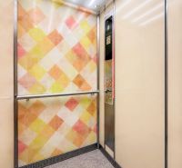 An elevator with a colorful wall and subtle lighting, ideal for a 3-room apartment.