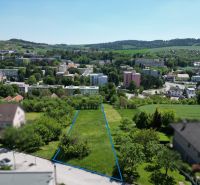 Aerial view of plots - housing in Myjava surrounded by greenery and buildings.