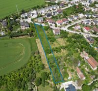 Aerial view of residential plots in Myjava surrounded by houses and greenery.