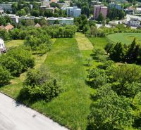 Plots - housing in Myjava with a view of greenery and surrounding buildings.