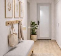 A hallway with a bench, decoration, built-in wardrobes, and a floor with a wooden decor in a 3-room apartment.