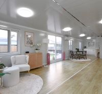 Interior of a family house with a wooden decor floor, a bright and spacious area.