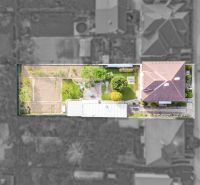 Aerial view of a family house on Niva Street in Trenčín with a well-maintained garden.