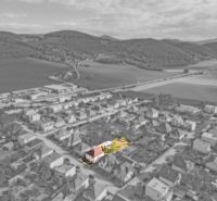 A family house on Niva Street in Trenčín, surrounded by other buildings with the surrounding nature.