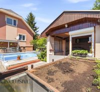 A family house in Gabčíkovo with a swimming pool and a terrace for growing plants.
