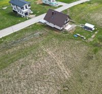 Aerial view of residential plots in Malý Slavkov by the road.