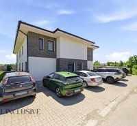 Parking lot near a two-story house with greenery in the town of Horný Bar, 3-room apartment.