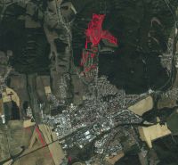 Aerial view of agricultural and forest land in Humenné, highlighted in red.