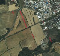 Aerial view of agricultural and forest land near Humenné with a part of the industrial zone.