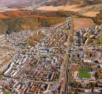 Aerial view of agricultural and forest land in Humenné with urban development.