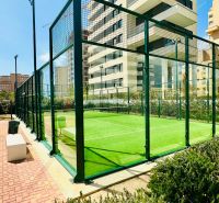 The exterior of a padel court near high-rise buildings in the city of Calpe.
