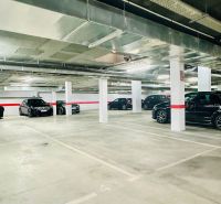 Underground parking for a 3-bedroom apartment in Calpe with multiple parking spaces.