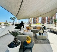 Spacious terrace at a 3-bedroom apartment in Calpe with comfortable seating and plants.