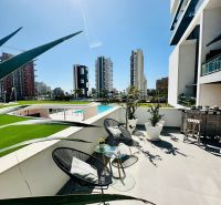 Balcony of a 3-bedroom apartment in Calpe with a view of the city and a modern terrace.