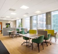 Bright offices with comfortable chairs and wood-patterned flooring.
