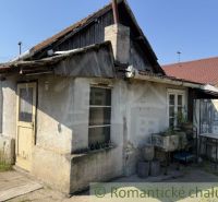 Older family house in Šurany, with a simple facade and wooden details.