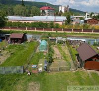 A garden in Medzilaborce with garden shelters and a raised bed according to the season.