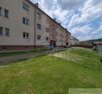 Apartment building in Medzilaborce with a grassy plot near a 2-room apartment.