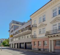 Buildings on Dunajská Street in Bratislava with historical facades and balconies.