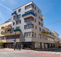 An apartment building on Dunajská Street in Bratislava offering 4-room apartments with balconies.
