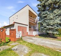 Family house in Topoľníky, fencing, gate, terrace, large tree in the yard.