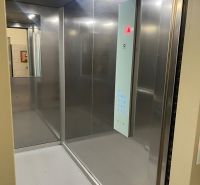 The interior of an elevator with modern lighting in a 3-room apartment.