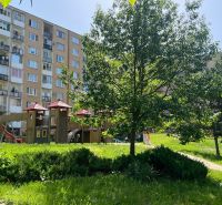 Apartment building and children's playground surrounded by greenery on Juhoslovanská, Košice - Sídlisko Ťahanovce.