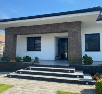 A family house on Jasná Street in Veľké Dvorníky with a modern entrance and garden.