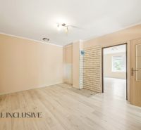 Interior of a family house with a wooden decor floor and light walls.