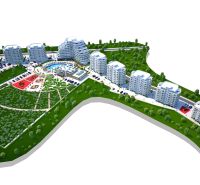 A resort with a complex of buildings, greenery, and a swimming pool near the town of Iskele.