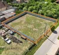 A residential plot on Ižop Street in Veľký Meder, fenced and ready for construction.
