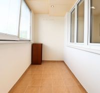 Glazed loggia with ceramic flooring in a 3-room apartment.