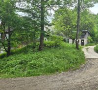 The greenery of the surrounding nature and wooden buildings in Terchová for Land - housing.
