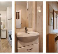 Bathroom with a shower and hallway in a 2-room apartment with a wooden decor floor.
