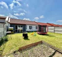 A family house in Rajka with a lawn, a children's playground, and space for gardening.