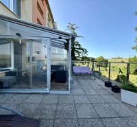 The balcony of a 3-room apartment on the 9th of May Housing Estate in Vrbové with a view of greenery.