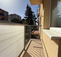 The balcony of a 3-room apartment on the 9th of May Housing Estate in Vrbové, view of greenery.