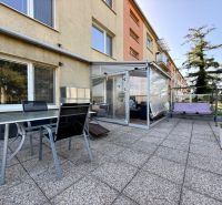Exterior of a 3-room apartment on 9th May Housing Estate in the town of Vrbové with a terrace and seating area.