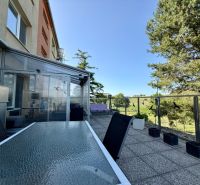 Terrace of a 3-room apartment on Sídlisko 9.mája in the town of Vrbové with a view of greenery.