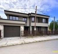 Two-story house with a garage and a fence in Lipany for Land - living.