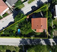 A family house on Zátoňská Street in Malinovo with a swimming pool and a garden.