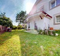 A family house on Zátoňská Street in Malinovo with a well-maintained garden and landscaped surroundings.