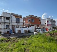 Construction of a family house in Prešov with unfinished structures and scaffolding around.